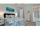 Comfortable bedroom with coastal-themed decor, including a turtle painting and accent pieces at 16612 5Th E Ave, Bradenton, FL 34212