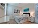 Comfortable bedroom featuring a cozy queen bed with stylish blue patterned bedding and complementing decor at 16612 5Th E Ave, Bradenton, FL 34212
