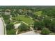 Aerial view of a community park featuring green space, trees, and walking paths at 16612 5Th E Ave, Bradenton, FL 34212