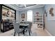 Charming dining room with stylish decor, a unique accent wall, and plenty of natural light at 16612 5Th E Ave, Bradenton, FL 34212