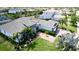 Beautiful single-story home with a stone facade, mature landscaping, and a tile roof at 16612 5Th E Ave, Bradenton, FL 34212
