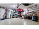 Organized garage with ample storage, workspace, and a clean epoxy floor perfect for hobbies and projects at 16612 5Th E Ave, Bradenton, FL 34212