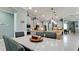 Open-concept kitchen with granite countertops, stainless steel appliances, and seamless flow into the dining area at 16612 5Th E Ave, Bradenton, FL 34212