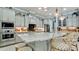 Gorgeous kitchen featuring stainless steel appliances, granite countertops, a large island, and ample cabinet space at 16612 5Th E Ave, Bradenton, FL 34212