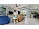 Spacious living room with stylish stone accent wall, plush furniture, and a bright, open layout at 16612 5Th E Ave, Bradenton, FL 34212
