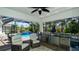 An outdoor kitchen includes a grill, beverage refrigerator, and comfortable seating at 16612 5Th E Ave, Bradenton, FL 34212