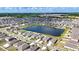 Panoramic aerial view showcases a meticulously planned community with a serene lake and rows of modern homes under a beautiful blue sky at 16633 Sunburst Lake S St, Wimauma, FL 33598
