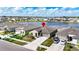 Beautiful home with a large lake view, well-manicured lawn, and a two-car garage at 16633 Sunburst Lake S St, Wimauma, FL 33598
