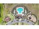 Aerial view of amenities featuring a pool, playground, and basketball court offering diverse recreation opportunities at 16633 Sunburst Lake S St, Wimauma, FL 33598