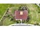 Bird's-eye view of a community basketball court, complete with manicured landscaping and a paved pathway to the recreational facility at 16633 Sunburst Lake S St, Wimauma, FL 33598