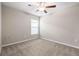 Bedroom features neutral walls, plush carpeting, and a window for natural light at 16633 Sunburst Lake S St, Wimauma, FL 33598