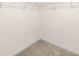 Carpeted walk-in closet with wire shelving offers ample storage at 16633 Sunburst Lake S St, Wimauma, FL 33598