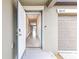 View of the front door opening to a bright entryway with tile flooring and neutral walls at 16633 Sunburst Lake S St, Wimauma, FL 33598