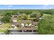 Aerial view of well-maintained townhomes near a pond and golf course at 170 Ingrid Pl, Oldsmar, FL 34677
