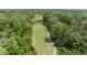 Scenic aerial view of a lush golf course winding through a green, tree-filled landscape at 170 Ingrid Pl, Oldsmar, FL 34677