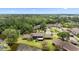 Scenic aerial view of homes by the lake, surrounded by lush greenery at 170 Ingrid Pl, Oldsmar, FL 34677