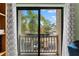 A private balcony overlooks lush tropical landscaping, providing the perfect retreat at 170 Ingrid Pl, Oldsmar, FL 34677
