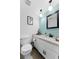 Stylishly updated bathroom with wainscoting, modern fixtures, and a clean, inviting design at 170 Ingrid Pl, Oldsmar, FL 34677