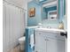 Blue toned bathroom featuring a stylish vanity, mirror, and shower at 170 Ingrid Pl, Oldsmar, FL 34677