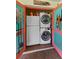 Convenient laundry room includes stackable washer/dryer and shelving, maximizing space at 170 Ingrid Pl, Oldsmar, FL 34677