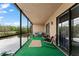 Relaxing screened lanai with cozy seating and a view of a serene pond at 170 Ingrid Pl, Oldsmar, FL 34677
