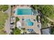 Aerial view of community pools with lounge chairs and recreational areas at 170 Ingrid Pl, Oldsmar, FL 34677