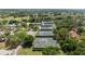 Aerial view of community tennis courts surrounded by lush greenery at 170 Ingrid Pl, Oldsmar, FL 34677