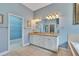 Bathroom featuring double sinks, a soaking tub, and a separate glass-enclosed shower at 1742 Oakwood Estates Dr, Plant City, FL 33563