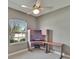 Bedroom with a built-in desk under the window and neutral colored walls and carpet at 1742 Oakwood Estates Dr, Plant City, FL 33563