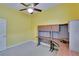 Bedroom with built in desk and ceiling fan at 1742 Oakwood Estates Dr, Plant City, FL 33563