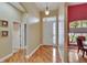 Warm and inviting foyer with hardwood floors and a view into the dining room at 1742 Oakwood Estates Dr, Plant City, FL 33563