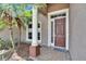 Close-up of the front door with a decorative column and a well-maintained brick walkway at 1742 Oakwood Estates Dr, Plant City, FL 33563