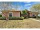 Charming single-story home with a well-maintained lawn, mature trees, and lush landscaping at 1742 Oakwood Estates Dr, Plant City, FL 33563