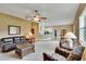 Spacious living room featuring a ceiling fan and neutral carpet at 1742 Oakwood Estates Dr, Plant City, FL 33563