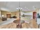 Open-concept living space with a kitchen and hardwood floors, creating a seamless flow at 1742 Oakwood Estates Dr, Plant City, FL 33563