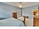 Spacious main bedroom with a ceiling fan and light blue walls with an exterior door at 1742 Oakwood Estates Dr, Plant City, FL 33563