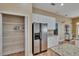 Walk-in pantry with wire shelving and stainless steel refrigerator in the kitchen at 1742 Oakwood Estates Dr, Plant City, FL 33563