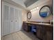 Spacious bathroom featuring a double sink vanity and large closet with bi-fold doors at 206 Soldier Ct, Seffner, FL 33584
