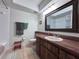 Bathroom with stylish vanity, modern fixtures, and decorative mirror above sink at 206 Soldier Ct, Seffner, FL 33584