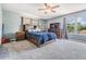 Main bedroom featuring an ensuite and neutral color scheme with a ceiling fan and carpet at 206 Soldier Ct, Seffner, FL 33584