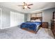 Primary bedroom featuring new carpet and a ceiling fan at 206 Soldier Ct, Seffner, FL 33584