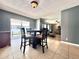 Open-concept dining area with access to a living room featuring wood-style floors at 206 Soldier Ct, Seffner, FL 33584