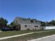 Exterior view of the two-story home and landscaped front yard on a sunny day at 206 Soldier Ct, Seffner, FL 33584