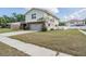Two-story home featuring a well-maintained lawn, attached garage, and a welcoming front entrance at 206 Soldier Ct, Seffner, FL 33584