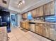 Bright kitchen with stainless steel appliances and natural wood cabinets at 206 Soldier Ct, Seffner, FL 33584