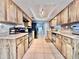 Spacious kitchen featuring stainless steel appliances, tiled floors, and natural wood cabinets at 206 Soldier Ct, Seffner, FL 33584