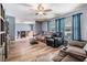 Inviting living room with hardwood floors, comfortable seating, and natural light from large windows at 206 Soldier Ct, Seffner, FL 33584