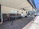 Screened patio with outdoor seating and view of backyard at 206 Soldier Ct, Seffner, FL 33584