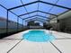 Backyard view of in-ground pool with screened enclosure, adjacent to an outdoor entertaining space at 206 Soldier Ct, Seffner, FL 33584