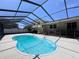 Full view of the inviting in-ground pool with screened enclosure, concrete patio, and back yard at 206 Soldier Ct, Seffner, FL 33584